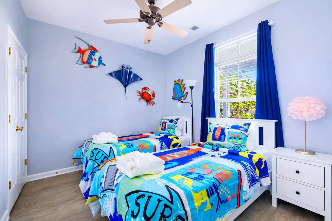 Surf-themed bedroom with two twin beds